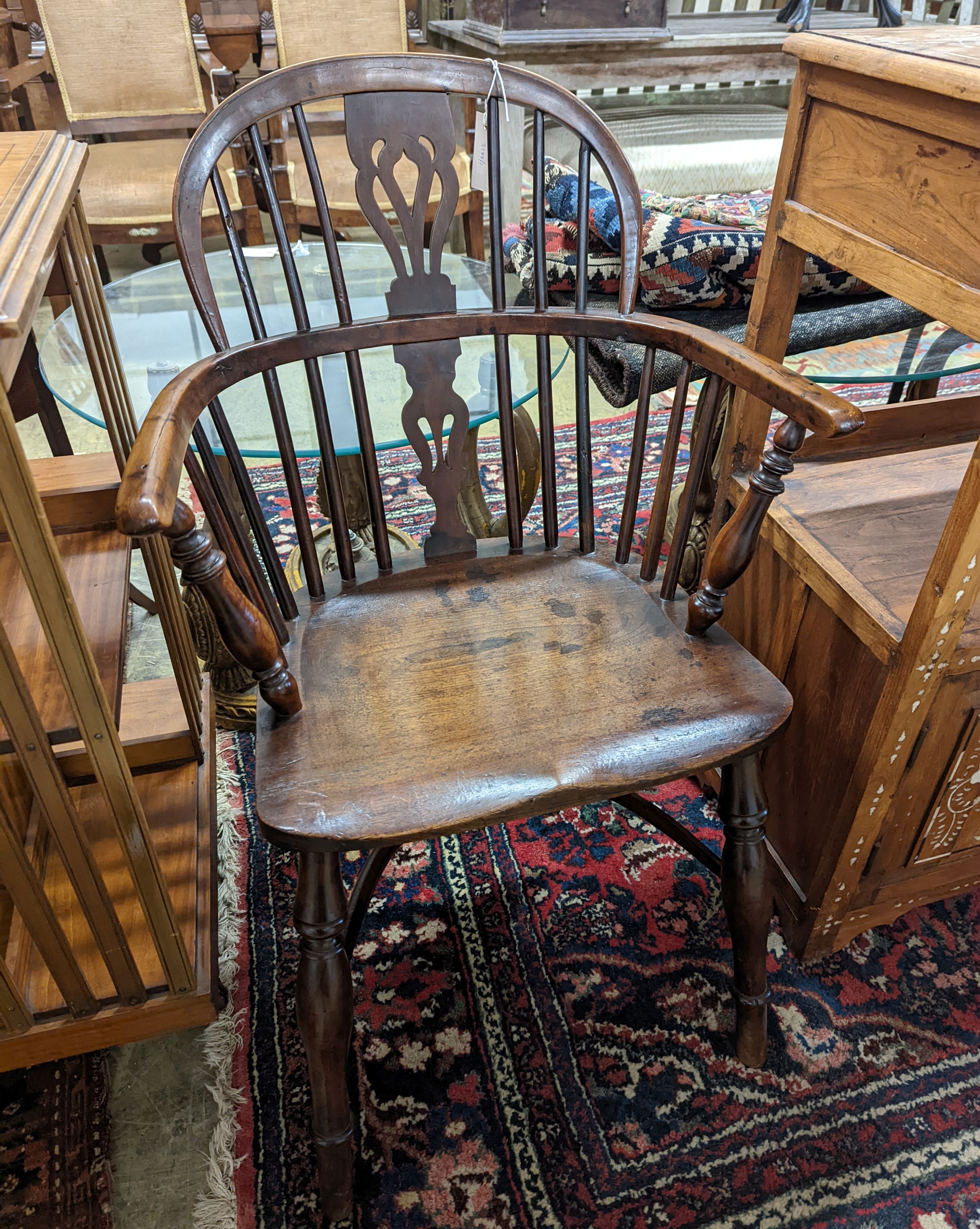 A mid 19th century Derbyshire area yew and elm Windsor elbow chair, width 57cm, depth 40cm, height 92cm